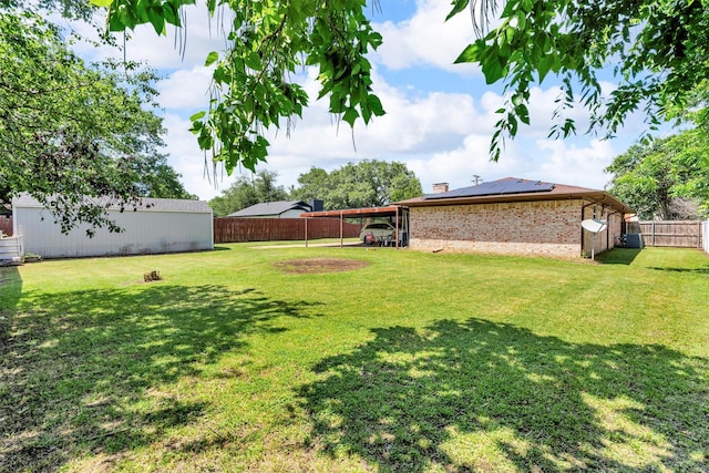 845 Griffith Ave, Terrell, TX 75160 - fenced backyard with a carport and an outdoor structure