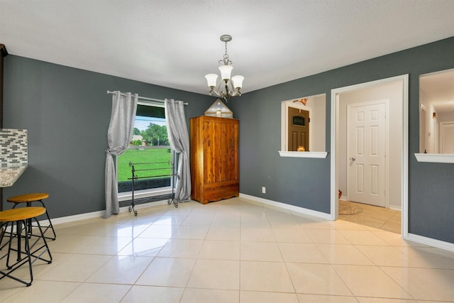 845 Griffith Ave, Terrell, TX 75160 - empty room with a chandelier and tile patterned flooring