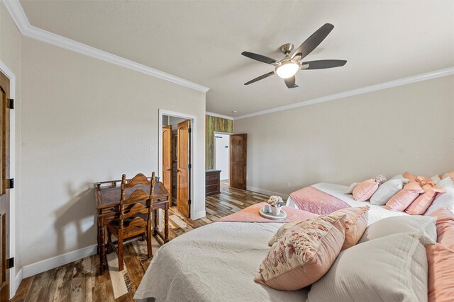 139 County Road 376, Lott, TX 76656 - bedroom with ornamental molding, wood finished floors, and ceiling fan