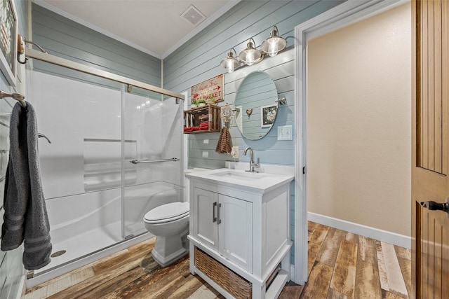 139 County Road 376, Lott, TX 76656 - bathroom featuring vanity, a shower stall, wood finished floors, and ornamental molding