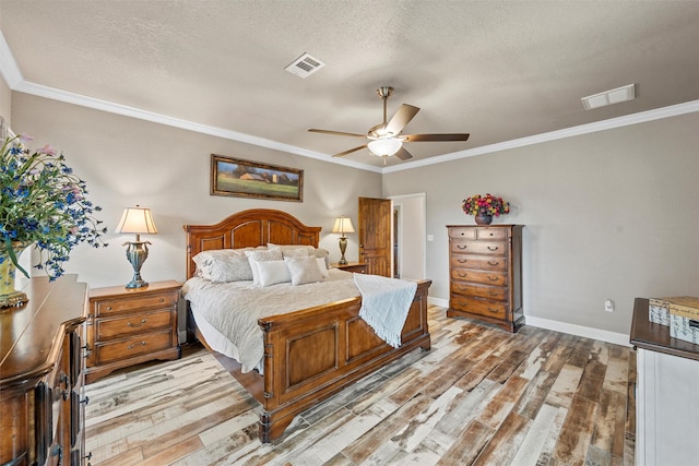 139 County Road 376, Lott, TX 76656 - bedroom with light wood-type flooring, ornamental molding, a textured ceiling, and ceiling fan