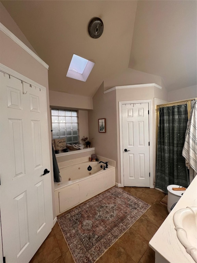 1507 Bridge Water Ln, Mansfield, TX 76063 - full bathroom with a skylight, vaulted ceiling, a whirlpool tub, tile patterned floors, and vanity