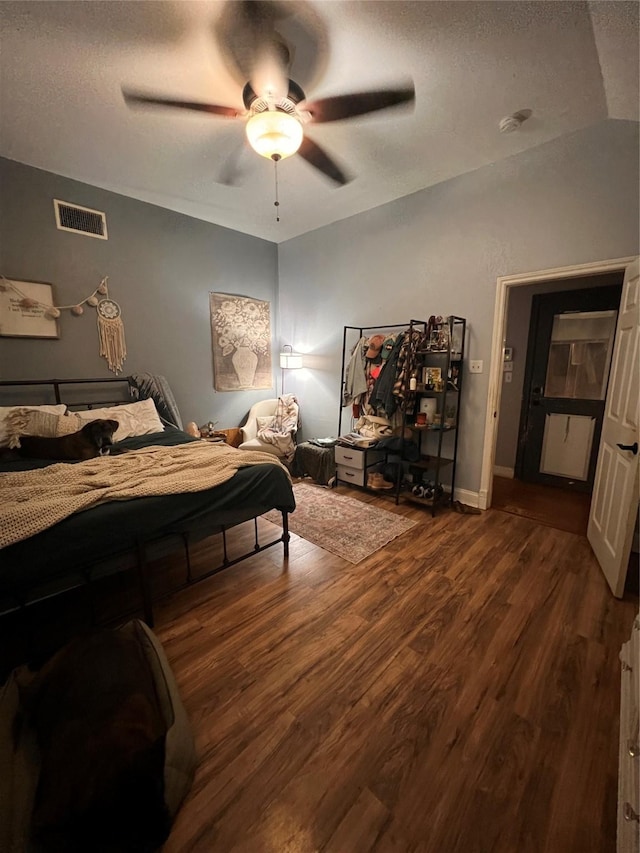 1507 Bridge Water Ln, Mansfield, TX 76063 - bedroom with dark wood finished floors, a textured ceiling, and a ceiling fan