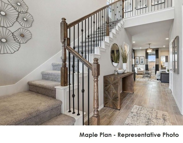 1806 Iris, Melissa, TX 75454 - staircase with wood finished floors, a high ceiling, a ceiling fan, and recessed lighting