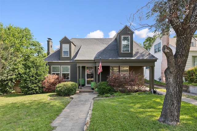 1635 Taft St, Dallas, TX 75208 - new england style home with a front lawn and a chimney