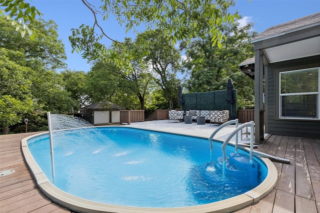 1635 Taft St, Dallas, TX 75208 - swimming pool featuring a wooden deck, outdoor lounge area, and view of wooded area