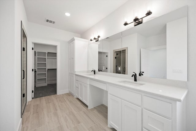 5150 Fox Trot Ln, Caddo Mills, TX 75135 - full bathroom with double vanity, a walk in closet, and recessed lighting