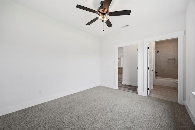 5150 Fox Trot Ln, Caddo Mills, TX 75135 - unfurnished bedroom with carpet flooring, connected bathroom, and ceiling fan