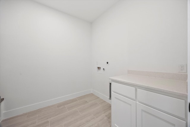 5150 Fox Trot Ln, Caddo Mills, TX 75135 - laundry room featuring electric dryer hookup, light wood-style floors, hookup for a washing machine, and cabinet space