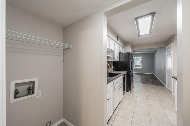 5105 French Wood Dr, Arlington, TX 76016 - laundry room featuring hookup for a washing machine and light tile patterned floors