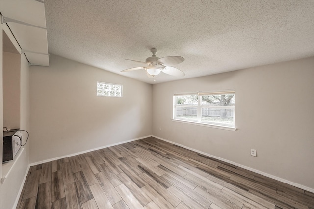 5105 French Wood Dr, Arlington, TX 76016 - unfurnished room featuring ceiling fan, wood finished floors, and a textured ceiling