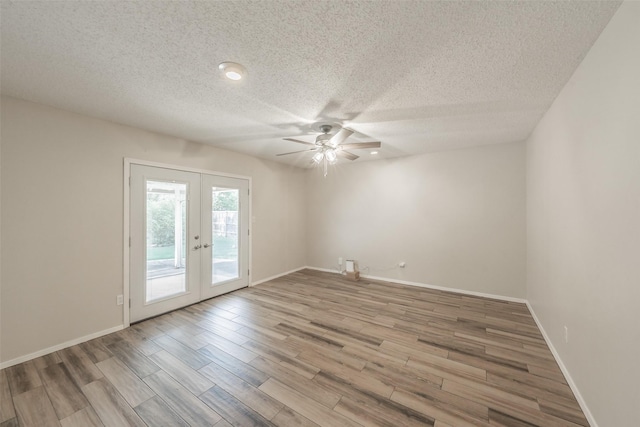 5105 French Wood Dr, Arlington, TX 76016 - empty room with french doors, ceiling fan, a textured ceiling, and wood finished floors