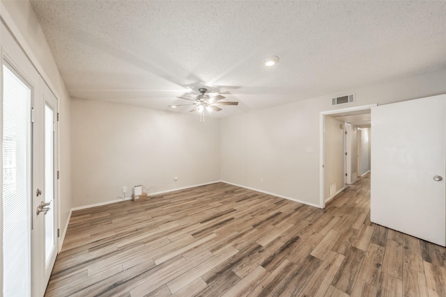 5105 French Wood Dr, Arlington, TX 76016 - empty room featuring ceiling fan, light wood-style floors, and a textured ceiling