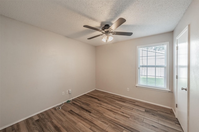 5105 French Wood Dr, Arlington, TX 76016 - spare room with wood finished floors, a ceiling fan, and a textured ceiling