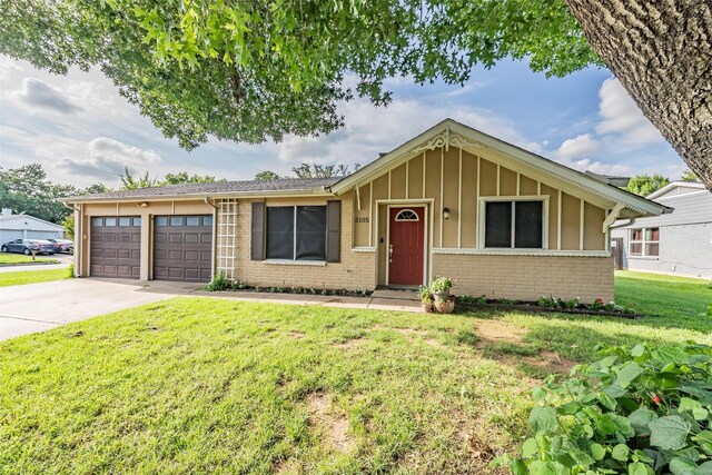 5105 French Wood Dr, Arlington, TX 76016 - single story home with brick siding, a garage, driveway, board and batten siding, and a front yard