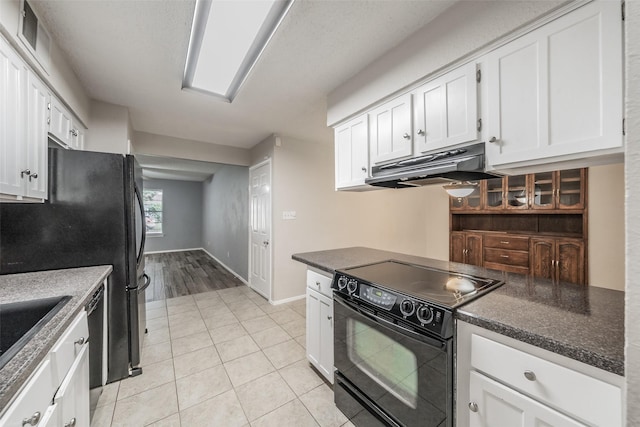 5105 French Wood Dr, Arlington, TX 76016 - kitchen featuring black appliances, under cabinet range hood, white cabinetry, and light tile patterned floors