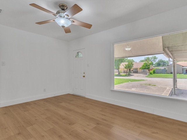 422 11th St, Grand Prairie, TX 75051 - spare room featuring light wood-type flooring and ceiling fan