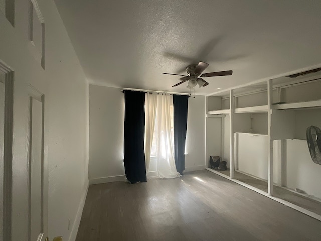1814 E Belt Line Rd, Carrollton, TX 75006 - unfurnished bedroom with wood finished floors, a ceiling fan, and a textured ceiling