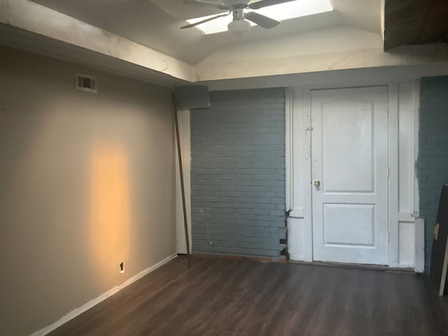 1814 E Belt Line Rd, Carrollton, TX 75006 - unfurnished bedroom with dark wood-style flooring, vaulted ceiling, and a ceiling fan