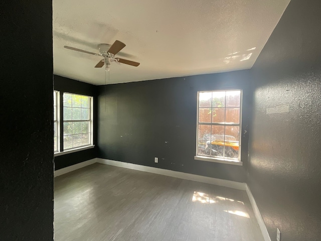 1814 E Belt Line Rd, Carrollton, TX 75006 - spare room with wood finished floors, ceiling fan, and a textured wall