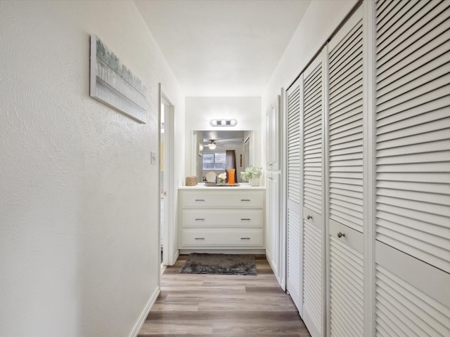 3207 Lynnwood Dr, Arlington, TX 76013 - corridor with light wood-type flooring and baseboards