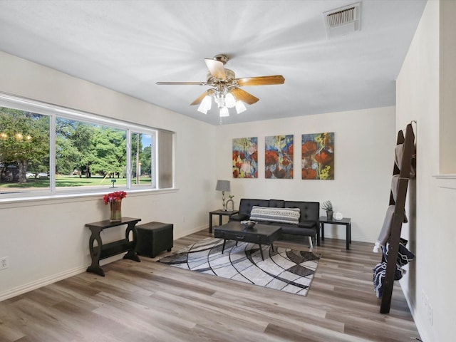 3207 Lynnwood Dr, Arlington, TX 76013 - living area with wood finished floors and ceiling fan