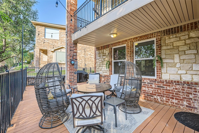 114 Mischief Ln, Rockwall, TX 75032 - wooden terrace with area for grilling and outdoor dining area