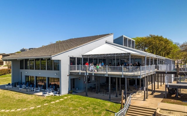 114 Mischief Ln, Rockwall, TX 75032 - back of property with a patio, a lawn, and a wooden deck