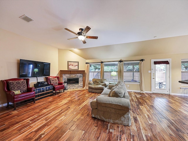 1597 Sweetbriar Dr, Allen, TX 75002 - living room featuring wood finished floors, ceiling fan, a stone fireplace, and vaulted ceiling