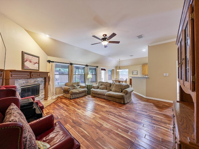 1597 Sweetbriar Dr, Allen, TX 75002 - living area featuring vaulted ceiling, ceiling fan, a fireplace, wood finished floors, and crown molding