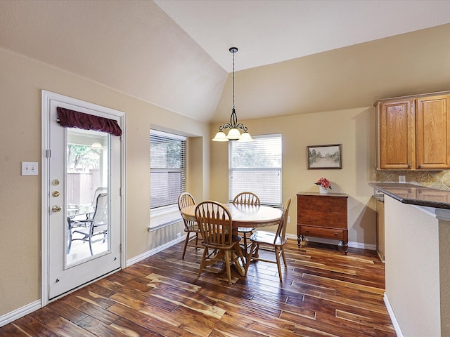 1597 Sweetbriar Dr, Allen, TX 75002 - dining room featuring dark wood-type flooring, healthy amount of natural light, a chandelier, and vaulted ceiling