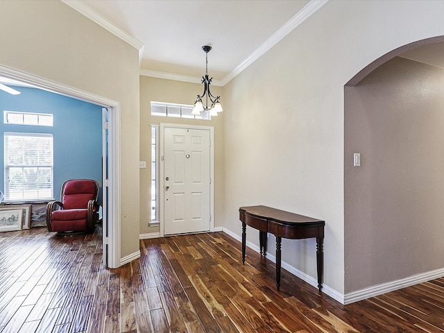 1597 Sweetbriar Dr, Allen, TX 75002 - entryway with arched walkways, ornamental molding, and dark wood finished floors