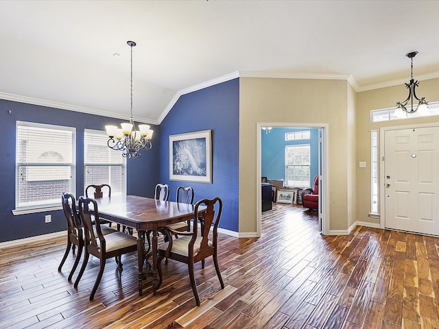 1597 Sweetbriar Dr, Allen, TX 75002 - dining area with a chandelier, crown molding, wood finished floors, and lofted ceiling