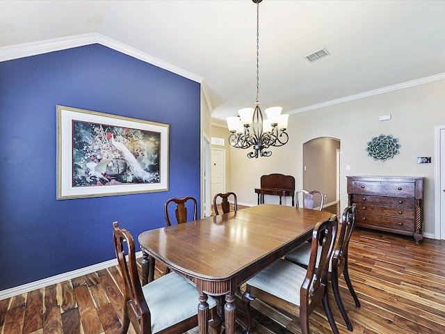 1597 Sweetbriar Dr, Allen, TX 75002 - dining room featuring arched walkways, wood finished floors, a chandelier, crown molding, and vaulted ceiling