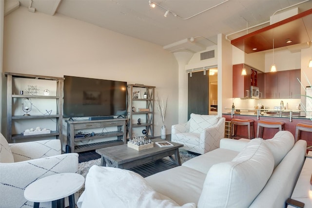2600 W 7th St Unit 2452, Fort Worth, TX 76107 - living area with lofted ceiling and rail lighting