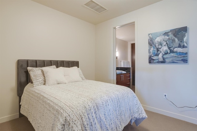 2600 W 7th St Unit 2452, Fort Worth, TX 76107 - carpeted bedroom featuring baseboards and ensuite bath