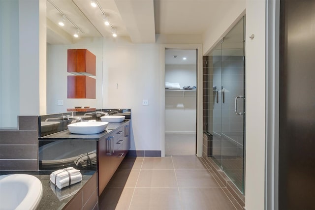 2600 W 7th St Unit 2452, Fort Worth, TX 76107 - full bathroom with double vanity, a shower stall, tile patterned floors, rail lighting, and a tub