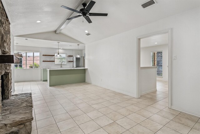 212 Timberlake Dr, Azle, TX 76020 - unfurnished living room featuring light tile patterned flooring, a ceiling fan, a stone fireplace, and recessed lighting