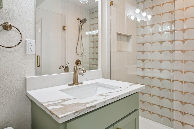 212 Timberlake Dr, Azle, TX 76020 - full bathroom with a textured wall, vanity, and a tile shower