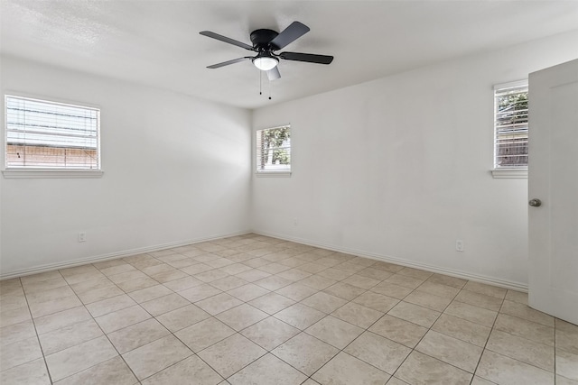 212 Timberlake Dr, Azle, TX 76020 - unfurnished room with healthy amount of natural light, ceiling fan, and light tile patterned flooring