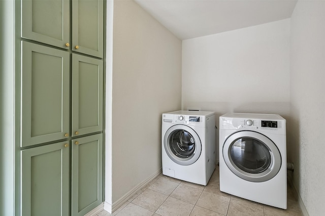 212 Timberlake Dr, Azle, TX 76020 - washroom with cabinet space, washing machine and dryer, and light tile patterned floors