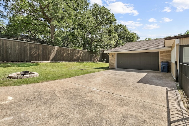 212 Timberlake Dr, Azle, TX 76020 - view of yard with an outdoor fire pit, driveway, and an attached garage