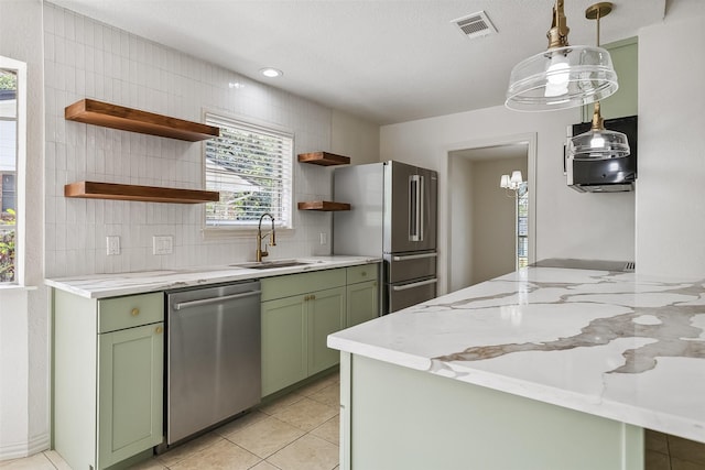 212 Timberlake Dr, Azle, TX 76020 - kitchen with appliances with stainless steel finishes, green cabinets, open shelves, and backsplash