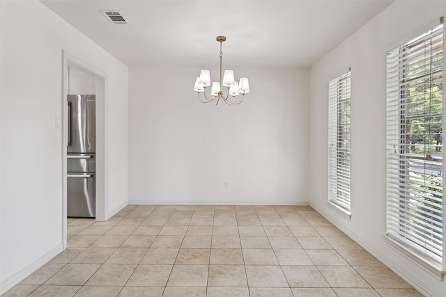 212 Timberlake Dr, Azle, TX 76020 - empty room featuring plenty of natural light, a chandelier, and light tile patterned flooring