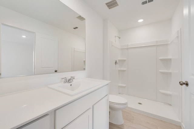 1620 Baugh St, Mckinney, TX 75071 - bathroom featuring vanity, a shower, wood finished floors, and recessed lighting