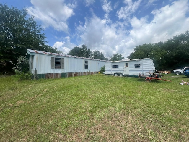 740 Ash St, Blossom, TX 75416 - rear view of house featuring a yard