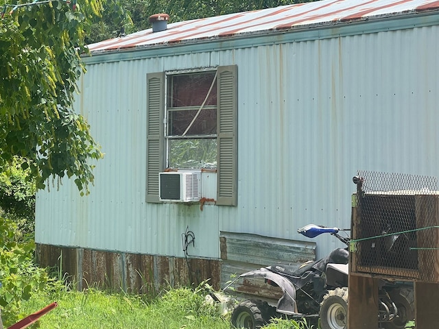 740 Ash St, Blossom, TX 75416 - view of property exterior with cooling unit and a metal roof