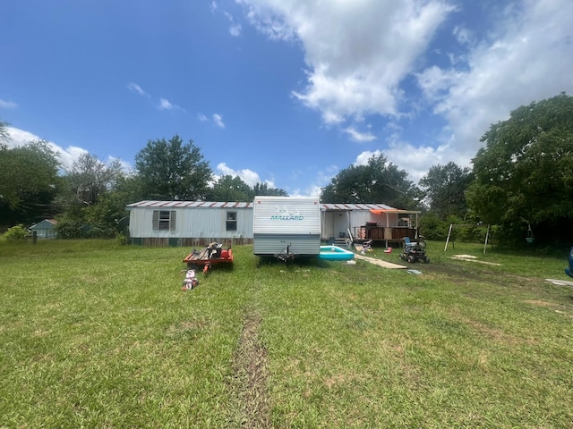 740 Ash St, Blossom, TX 75416 - back of house with a yard