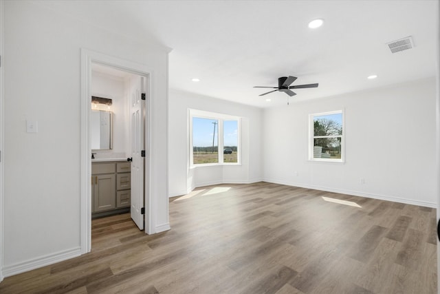 110 Vz County Road 1128, Fruitvale, TX 75127 - unfurnished bedroom with multiple windows, wood finished floors, recessed lighting, a ceiling fan, and ensuite bathroom