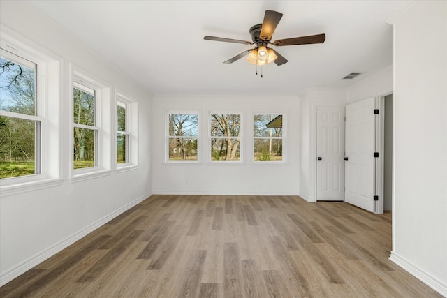 110 Vz County Road 1128, Fruitvale, TX 75127 - empty room with light wood-style flooring, ceiling fan, and crown molding